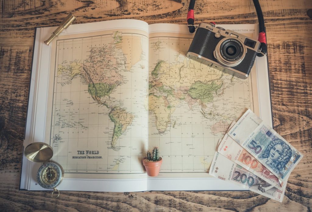 map and camera ready to go backpacking in Europe with kids